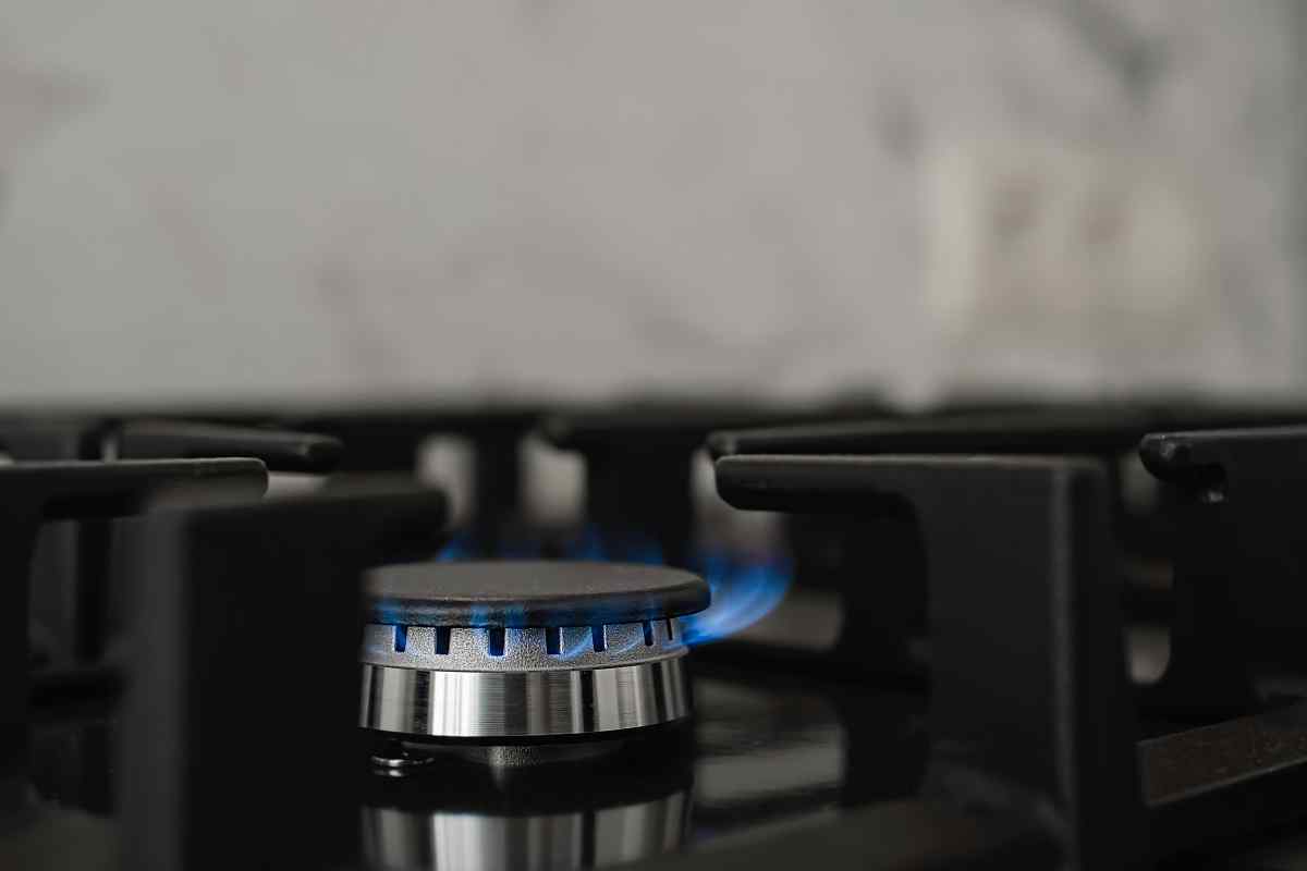 Modern Kitchen Stove Natural Gas Burns With Blue Flame Household Gas Consumption Close Up Selective Focus